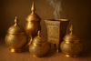 Decorative gold containerS OF BAKOOR with intricate designs on a GOOD background

